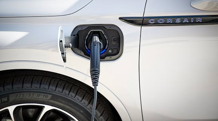 An electric charger is shown plugged into the charging port of a Lincoln Corsair® Grand Touring
model. | Parks Lincoln of Tampa in Tampa FL